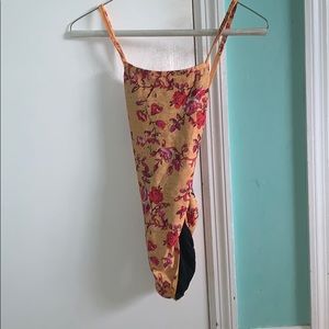 A yellow jolyn one piece in the style “Brandon”